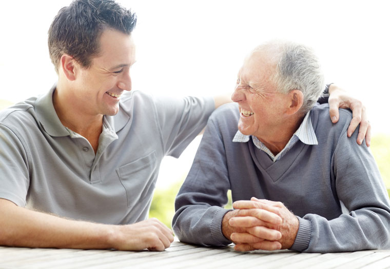 A man discusses the benefits of dementia care at home in the Syracuse area with his elderly father.