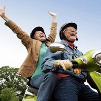 happy-senior-couple-on-moped