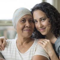 senior woman with cancer and daughter