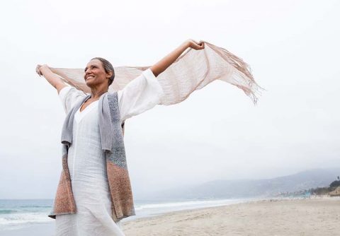 happy-woman-on-windy-beach