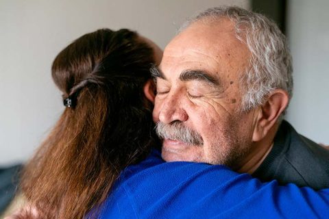 _caregiver-hugging-senior-man
