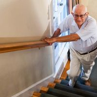 senior-man-walking-upstairs