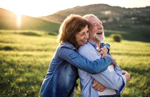 happy hugging seniors
