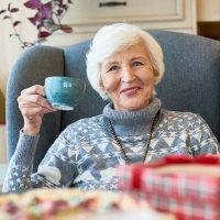 happy-senior-lady-drinking-coffee