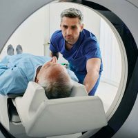 senior-man-getting-Cat-scan-with-technician