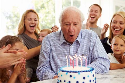 A family celebrates their older loved one after receiving good senior birthday party ideas.